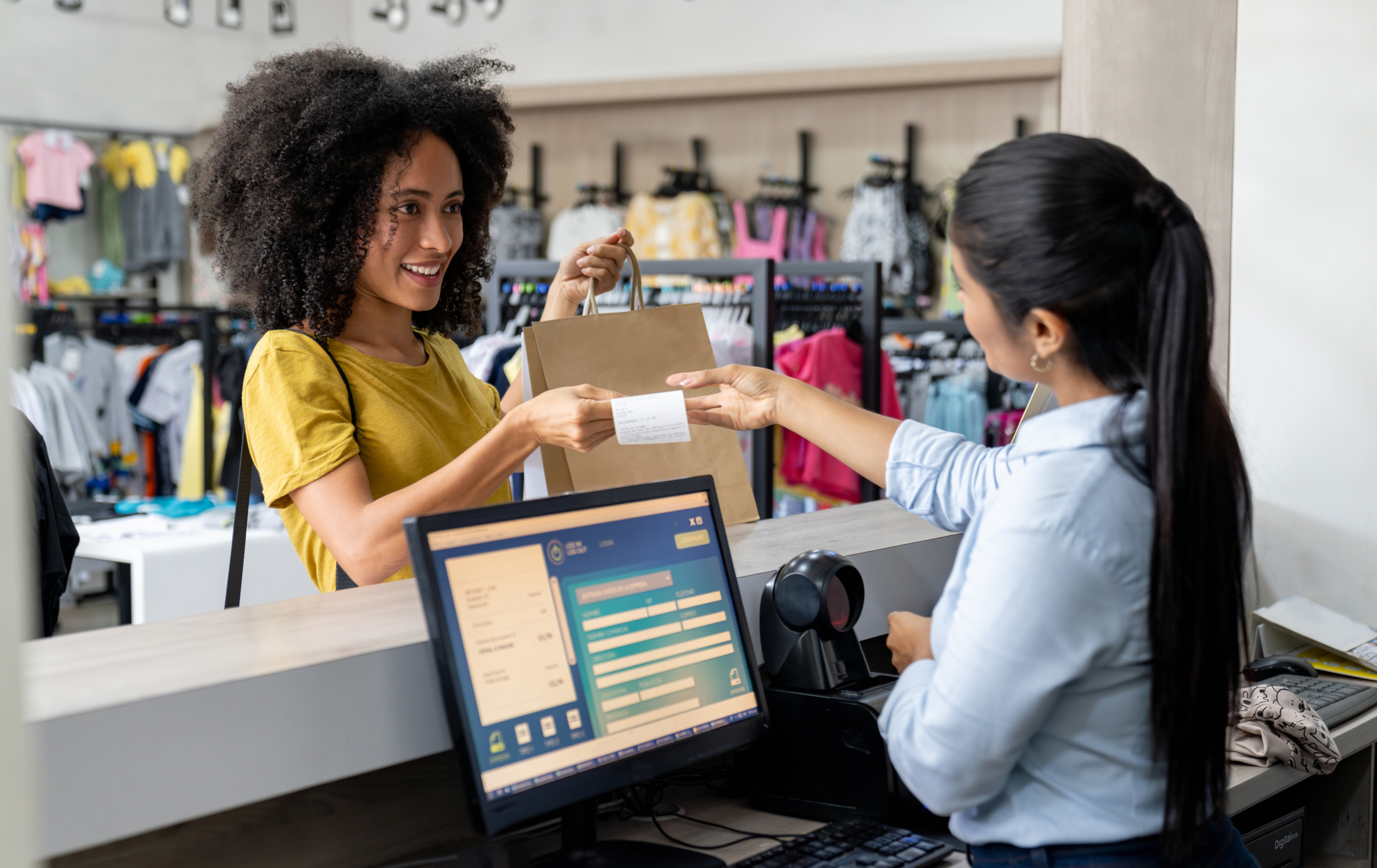 young woman receiving receipt at store 