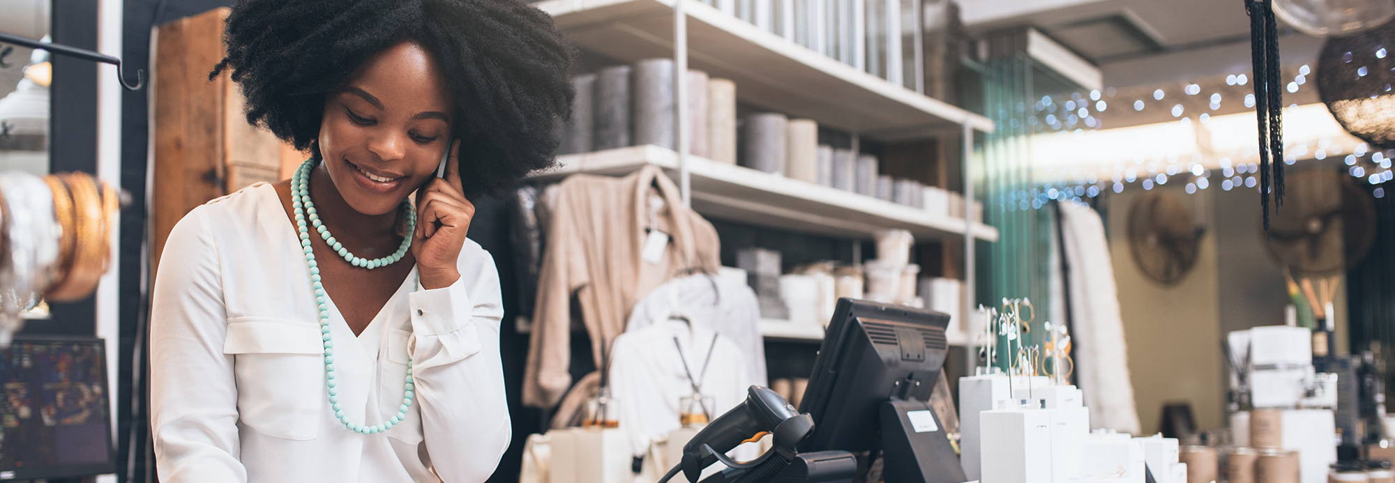 A store employee working near the cash register